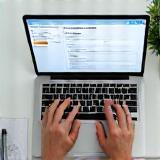 Enrollment form being filled on laptop